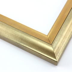 This high shine, gold and bronze foil wood frame features an elegant curve-and-scoop profile that draws the eye inward.  Slight distressing on the gold, and dark grey along the stepped ridge add a subtle antique finish.

1.75 " width: suitable for both medium and large images.  A striking border for a black and white photograph, or to highlight a classic painting or Giclée print.